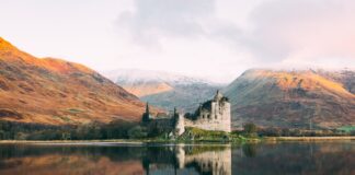 How Best to Spend 10 Days in Scotland gray concrete building near lake under white sky during daytime